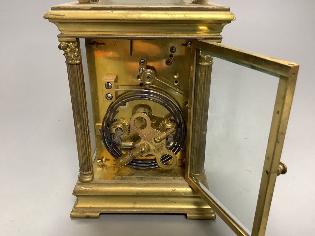 A large French gilt brass repeating carriage clock, signed EM and co.